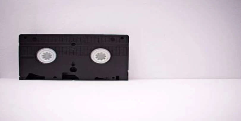 A VHS tape is placed on a white background.