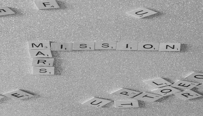 An image of scrabble tiles to form the words "Mars Mission".