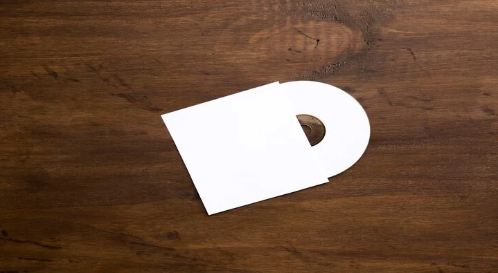 Image of blank cd mockup on a wooden texture.