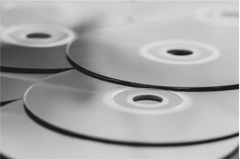 A closeup image of DVDs that are placed together.