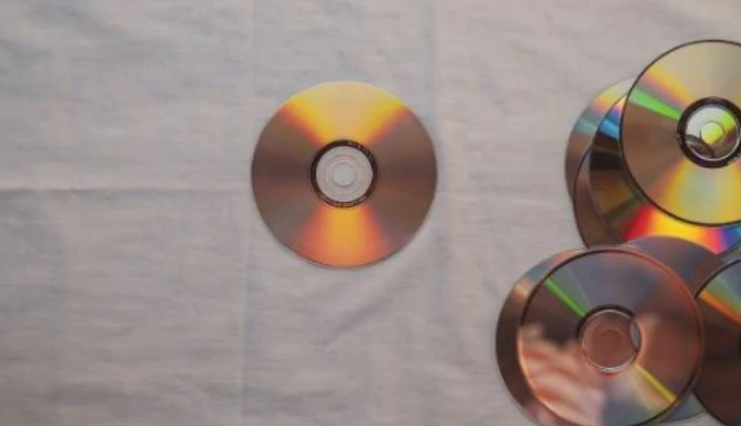 Image of DVDs placed on a white cloth.